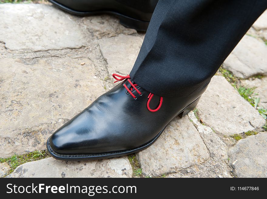 Person Wearing Black Leather Dress Shoes