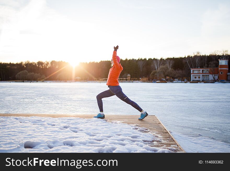 Photo of sports woman on morning exercise in winter