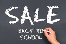 Hand Writing By White Chalk On A Blackboard. Back To School Sale. Royalty Free Stock Photo