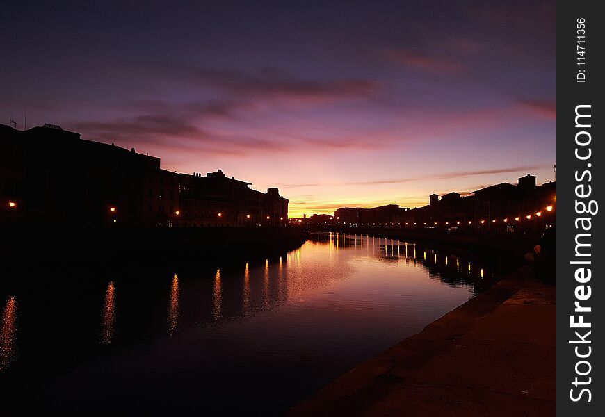 That& x27;s the beautiful Lungarno in Pisa when the sun goes down