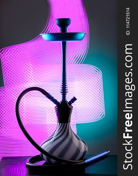 Blue eastern hookah on colorful background. Still life. Copy space