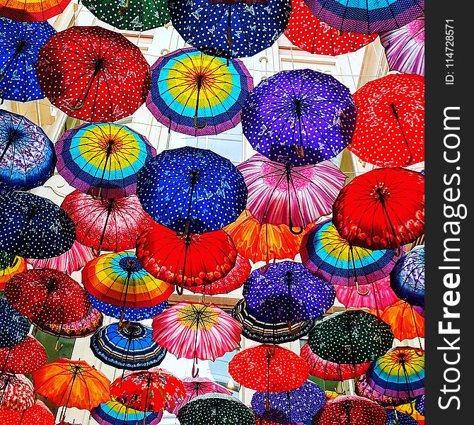Under colorful umbrellas. Under colorful umbrellas