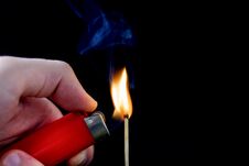Man Hand With Lighter Start Light On Matchstick On Black Royalty Free Stock Photos