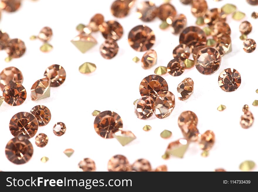 Many Scattered Rhinestones. On A White Background