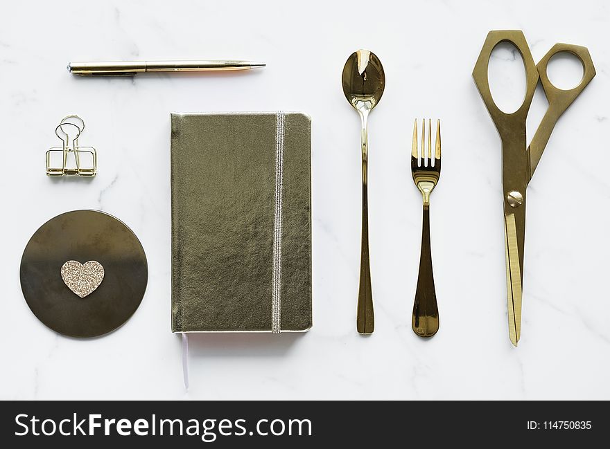 Top-view Photography of Silver Spoon, Book, Fork, Scissors, and Pen