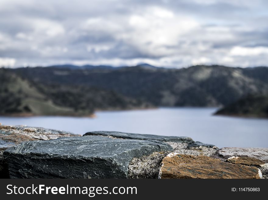 Photography of Lake Between Mountain at Daytime