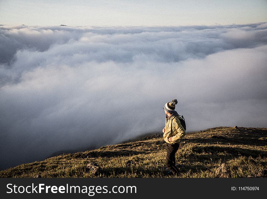 Man Standing on Top of Moutain