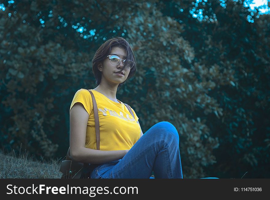 Woman in Yellow Short-sleeved Top and Blue Denim Jeans
