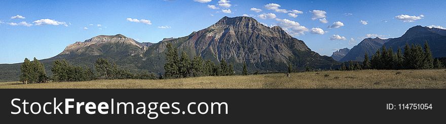 Brown Mountain Under Blue and White Sky