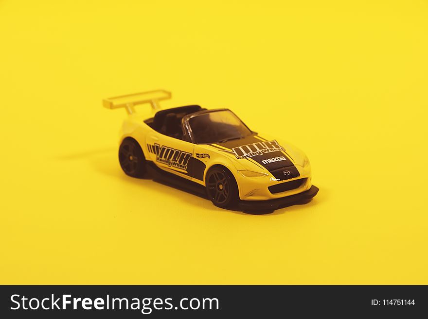 Yellow And Black Toy Car Model