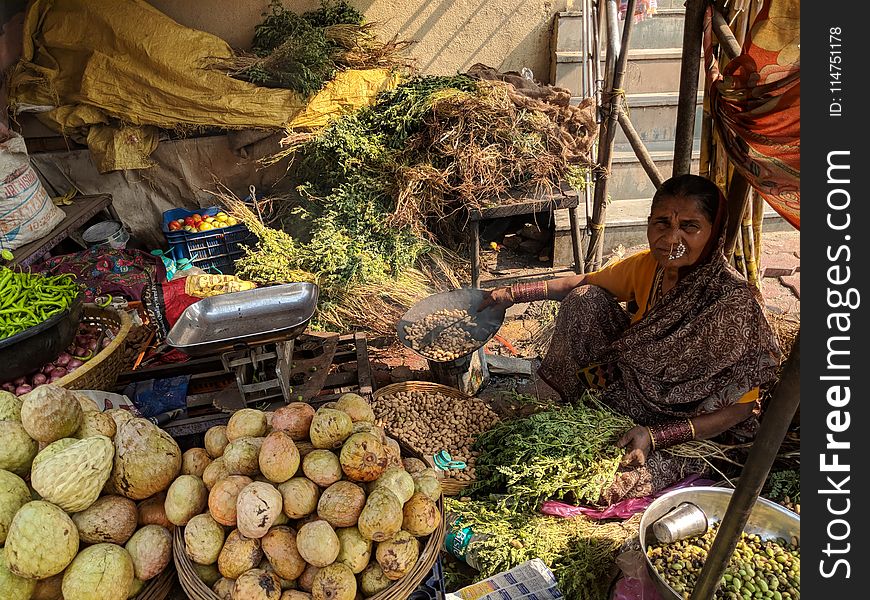 Woman Beside Vegetables On Baskets