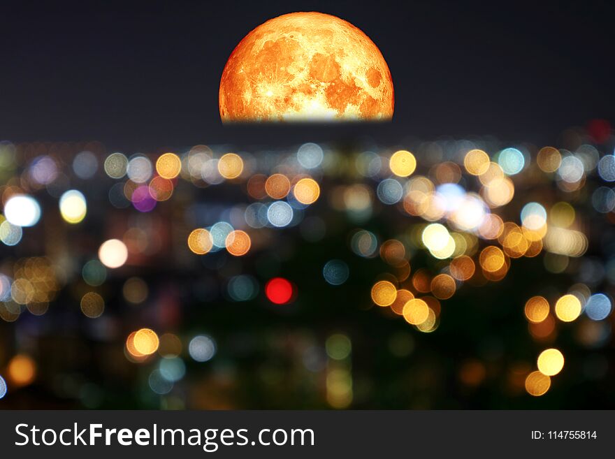 half blood moon and colorful of blur night light over city, Elements of this image furnished by NASA. half blood moon and colorful of blur night light over city, Elements of this image furnished by NASA