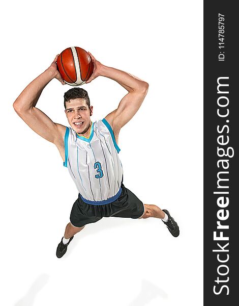 Full length portrait of a basketball player with a ball isolated on white studio background. advertising concept. Fit caucasian athlete jumping with ball. Motion, activity, movement concepts. Full length portrait of a basketball player with a ball isolated on white studio background. advertising concept. Fit caucasian athlete jumping with ball. Motion, activity, movement concepts.