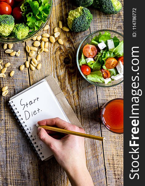 Concept diet and slimming plan with vegetables top view mock up