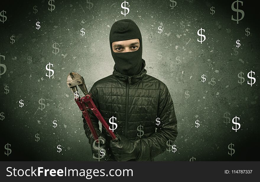 Money hungry thief in black clothes and tolls on his hand. Money hungry thief in black clothes and tolls on his hand.