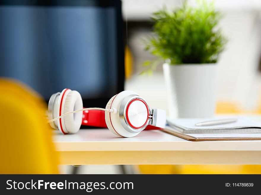 Empty Remote Office Workplace With Laptop And Headset