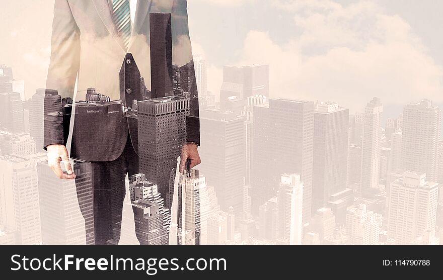 Handsome business man with overlay cityscape background