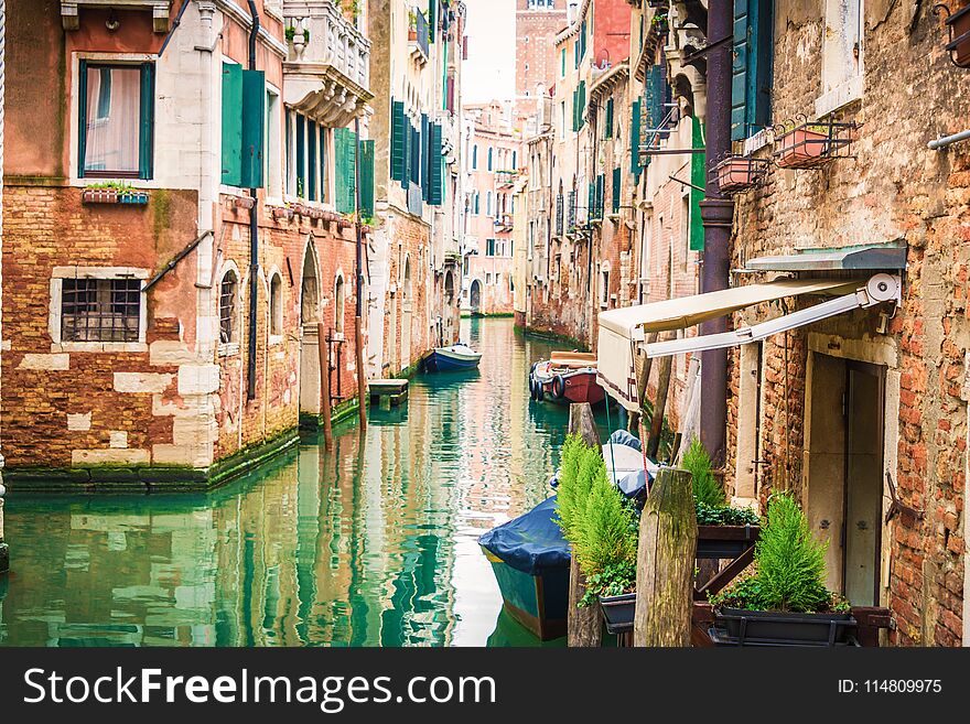 View of Venice traditional canal with boats .Venice is a popular tourist destination of Europe.