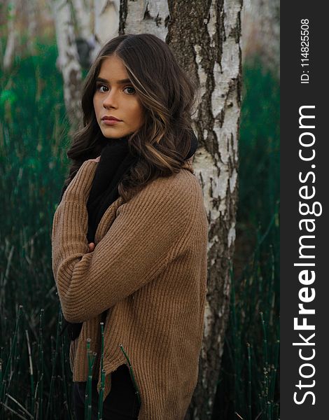 Woman Standing Beside Tree