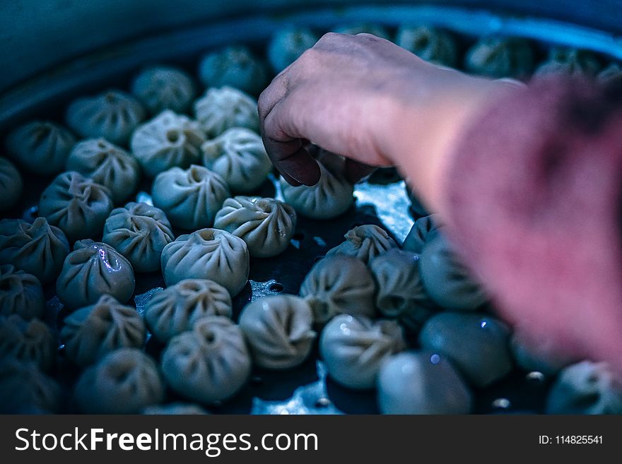 Person Holding Dumplings