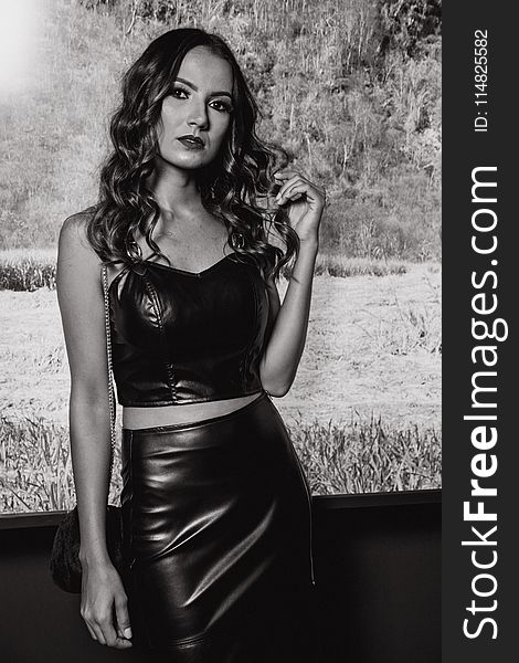 Monochrome Photography of Woman Wearing Black Leather Strapless Crop Top and Black Pencil Skirt