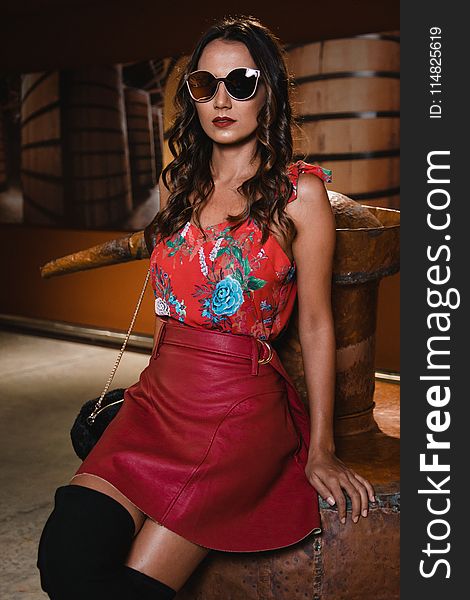 Photography of Woman Wearing Floral Top and Red Leather Skirt