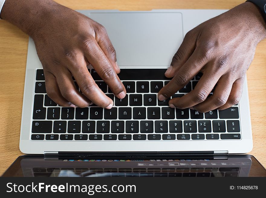 Person Typing On Laptop