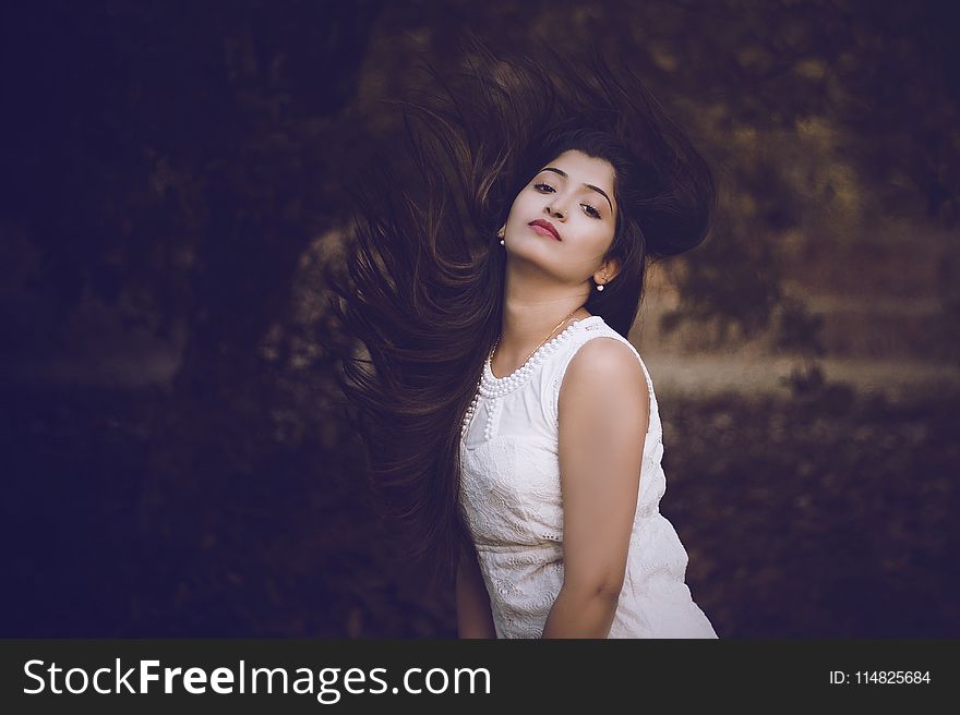 Selective Focus Photography of Woman in White Crew-neck Sleeveless Dress