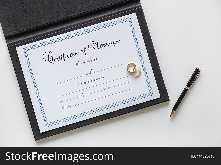 Certificate of Marriage and Two Gold-colored Rings