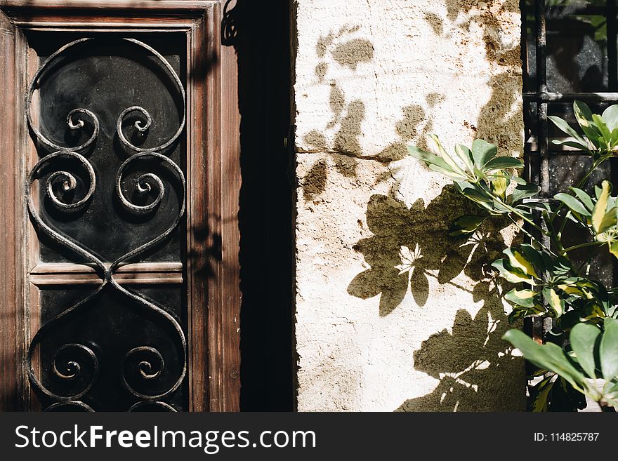 Brown And Black Wooden Window Pane