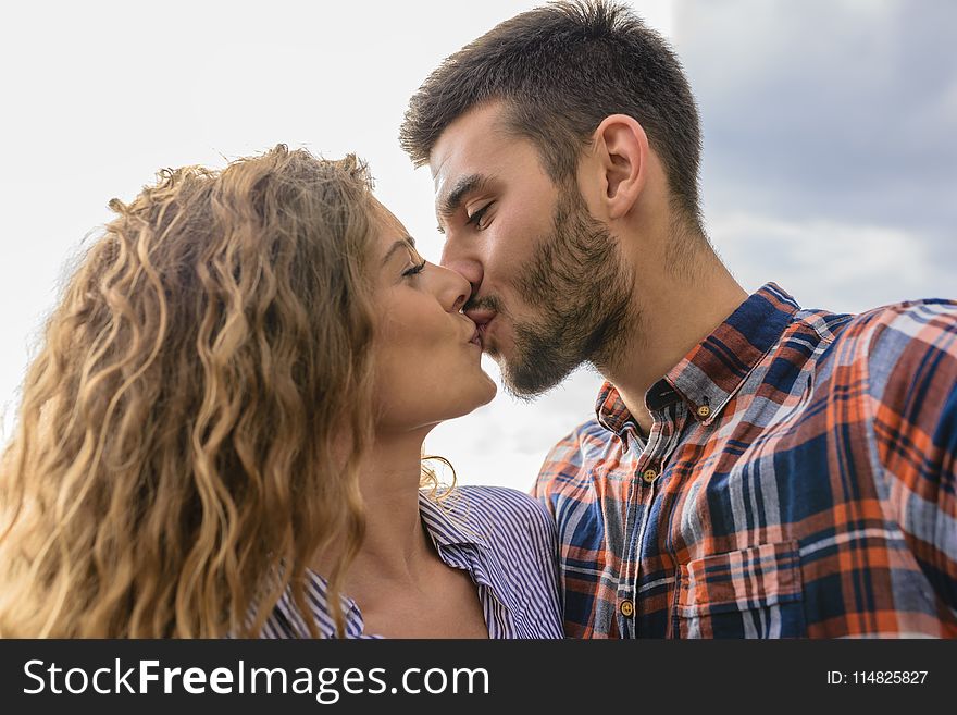 Woman And Man Kissing Each Other