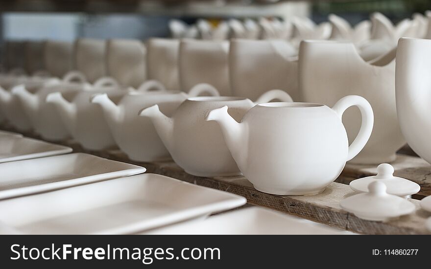 Internal view of an artistic ceramic workshop of vietri sul mare campania, cups and dishes put to dry before being painted, Vietri ceramics - Made in Italy excellence. Internal view of an artistic ceramic workshop of vietri sul mare campania, cups and dishes put to dry before being painted, Vietri ceramics - Made in Italy excellence