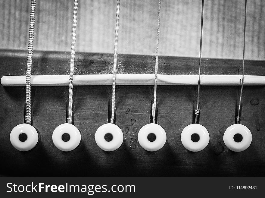 Closeup Grayscale Photo of Acoustic Guitar