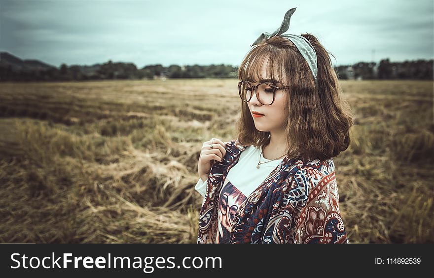 Selective Focus Photography of Woman Wearing Black Framed Eyeglasses and Gray Headband