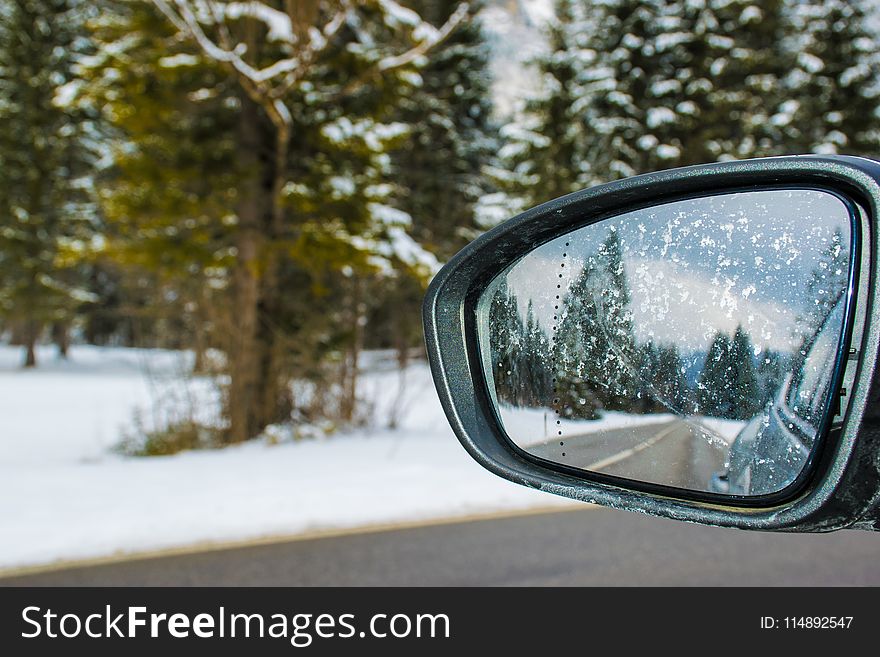 Framed Side Mirror Beside Snow Covered Field