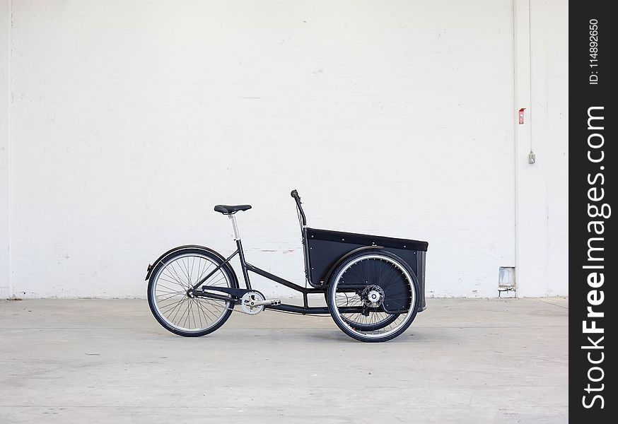Shallow Photography of Black Steel Adult Trike