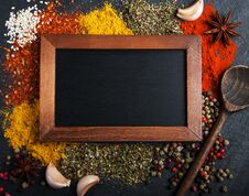 Different Kind Of Spices And Blackboard Stock Photo