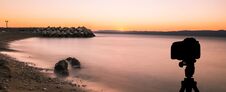 Camera On Tripod With Sunset Over The Sea In Background / Podgora, Croatia Stock Image
