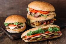 Chicken Sandwich And Two Different Kinds Of Hamburgers Stock Photography