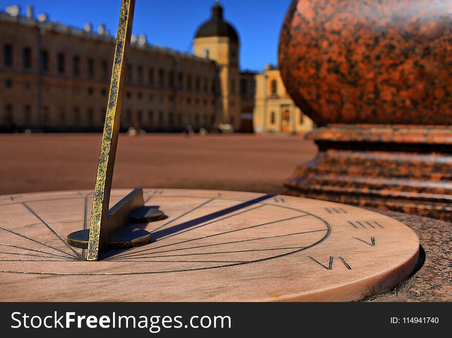 Sundial on a marble dial on the background of the European Palace