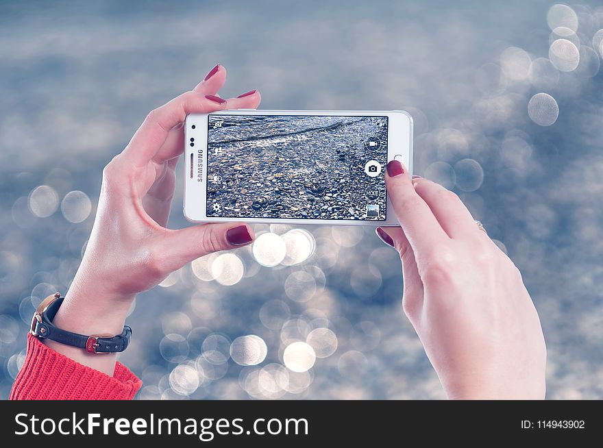 Selective Focus Photo of Person Holds White Samsung Galaxy Note Edge