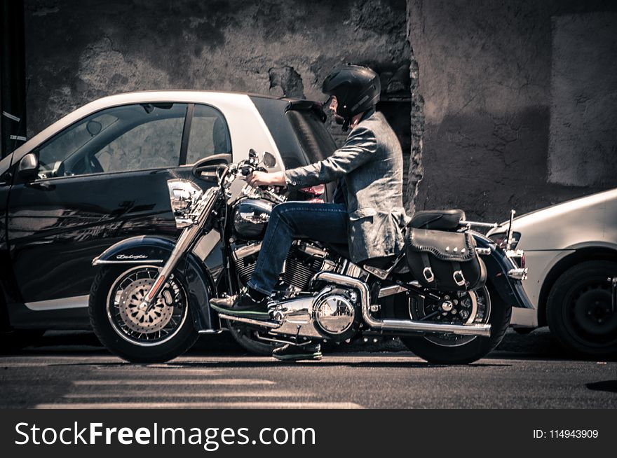 Man Riding a Black Touring Motorcycle
