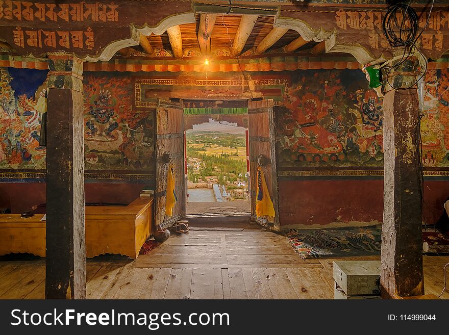 Ancient Thiksey monastery with view of murals on the inside wall and Himalayan mountians outside - it is a famous Buddhist temple in,Leh, Ladakh, Jammu and Kashmir, India. Ancient Thiksey monastery with view of murals on the inside wall and Himalayan mountians outside - it is a famous Buddhist temple in,Leh, Ladakh, Jammu and Kashmir, India.