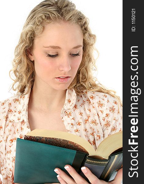 Beautiful teen girl reading.