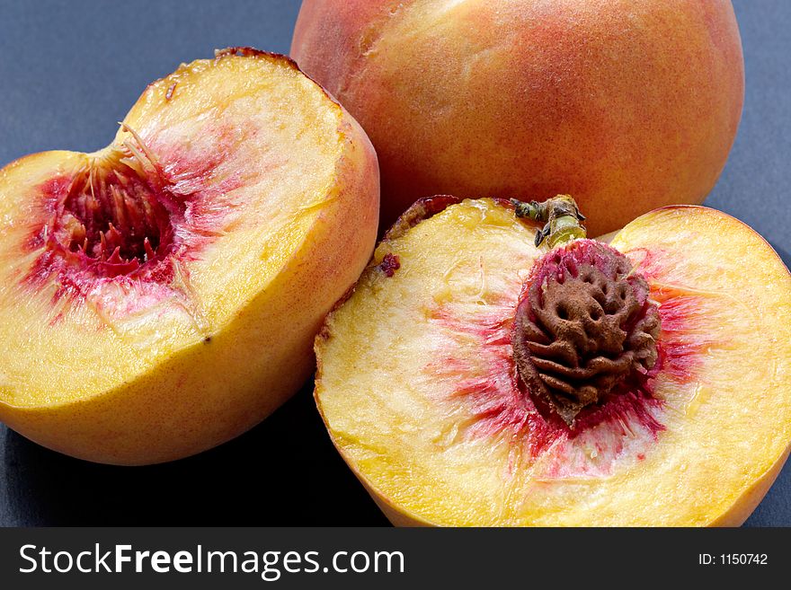 Ripe juicy fleshy cut peaches