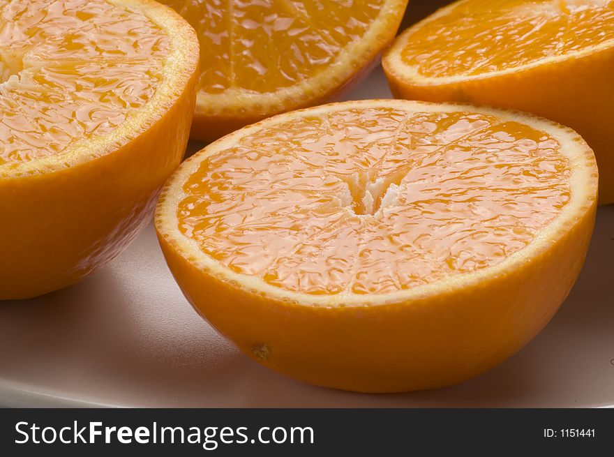 Close up of juicy oranges that have been halved