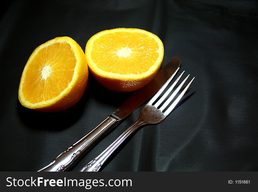 Cut orange on black background. Cut orange on black background