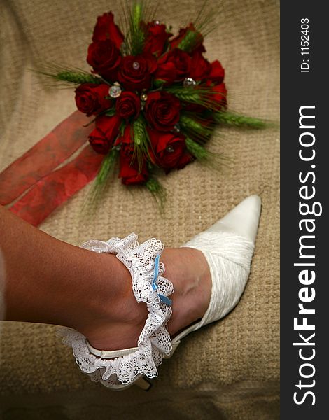 Bride putting on her garter. Bride putting on her garter