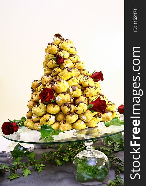 Small puff cakes stacked on glass plate. Small puff cakes stacked on glass plate