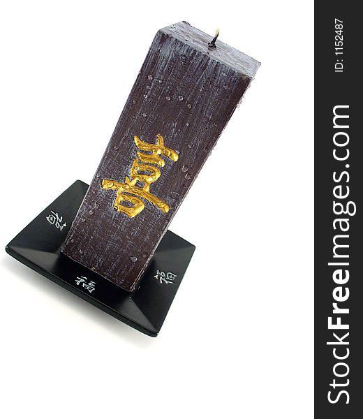 Oriental objects, black candle with golden letters. Oriental objects, black candle with golden letters